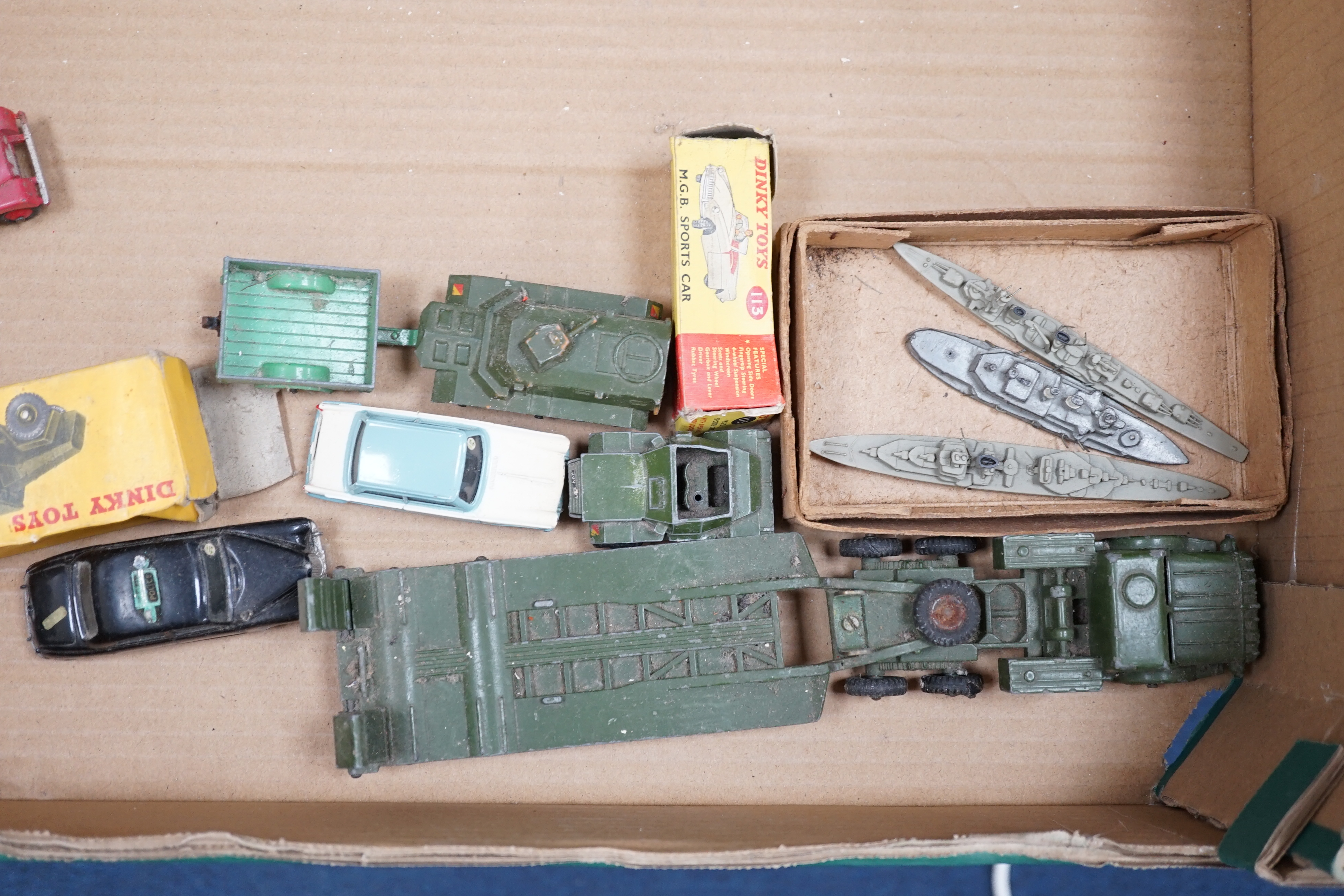 Thirteen Dinky Toys and Supertoys, etc. including; an MGB (113), a Riley Pathfinder, a Triumph Herald, an Armoured Command Vehicle (677), a 20-ton Mounted Crane (972), a Recovery Tractor (661)